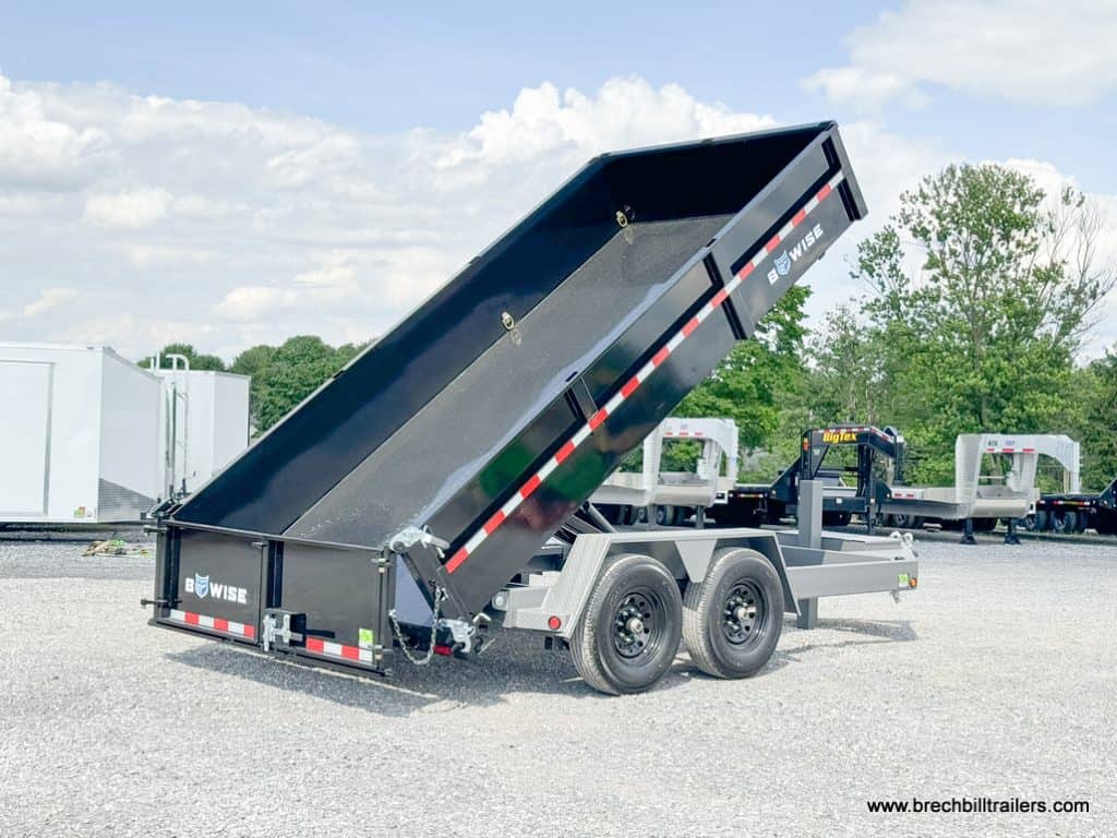 Demonstrating the dump position with the spreader gate.