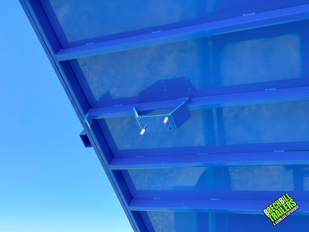 Fresh blue paint on a dump trailer