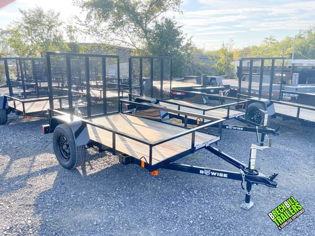 New Bwise UTE 3K Utility Landscape Trailer with black wheels parked.