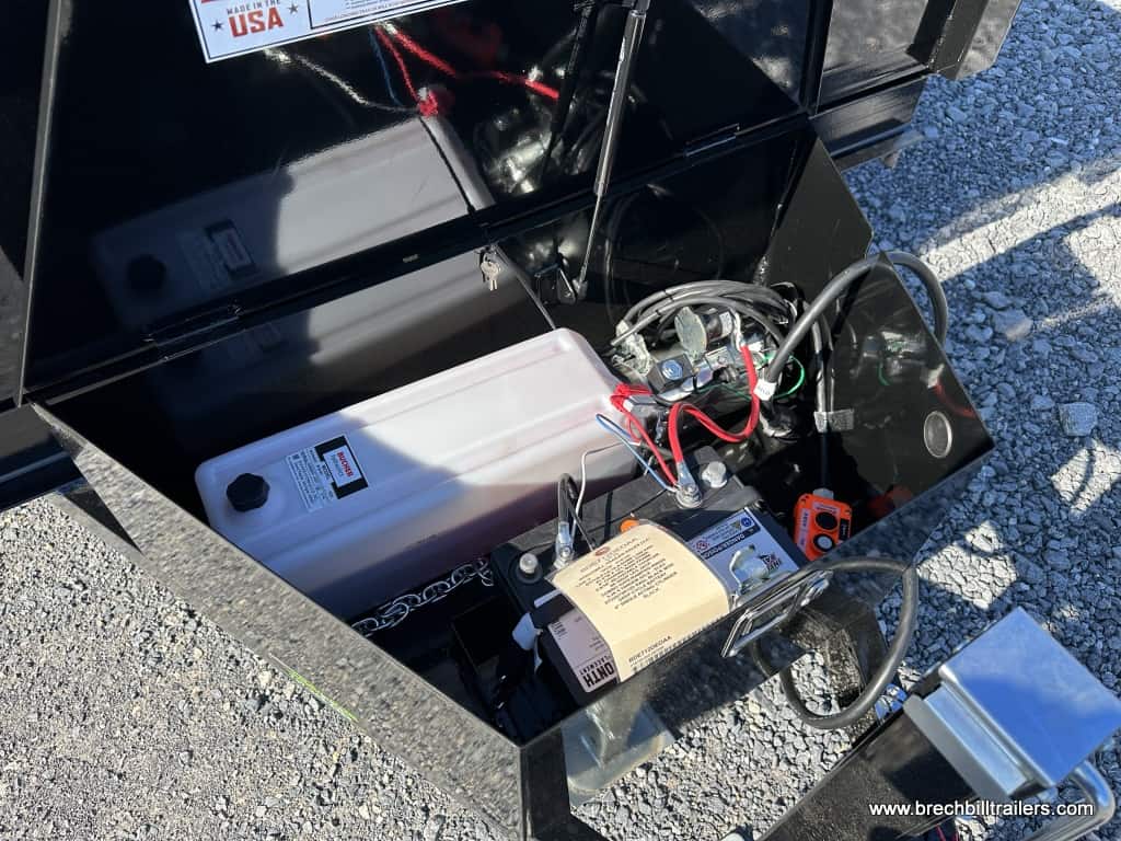 Hydraulic pump and battery on the Bwise LP LE Low Pro Dump Trailer
