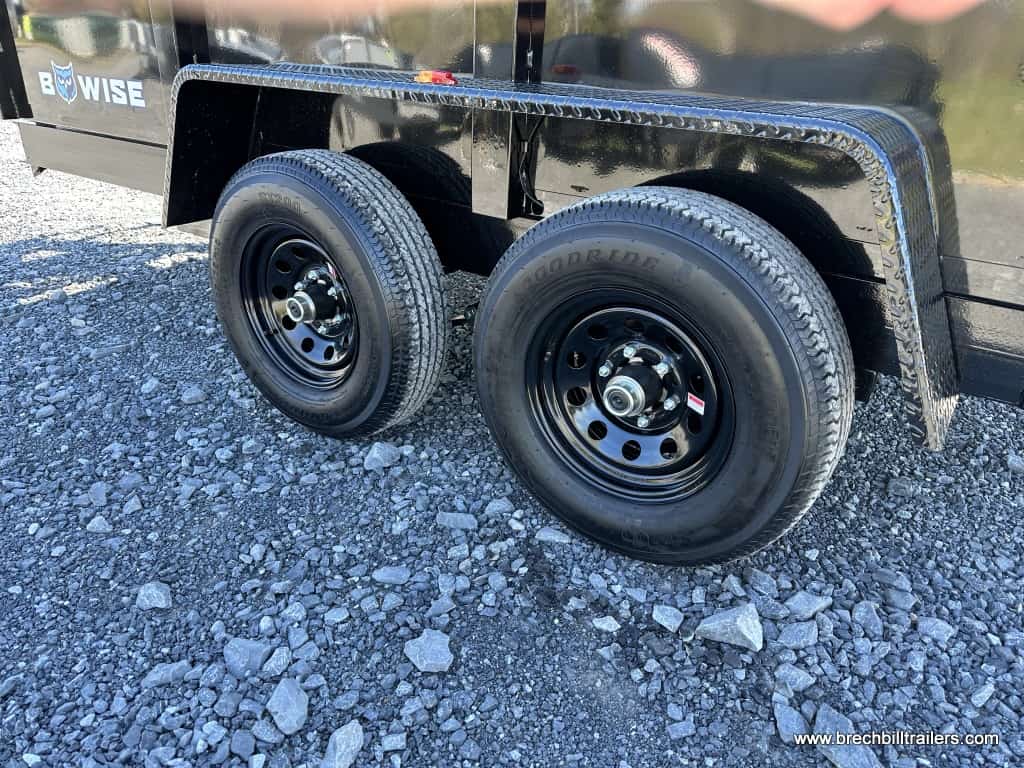 Black wheels on a Bwise 7x12 dump trailer.