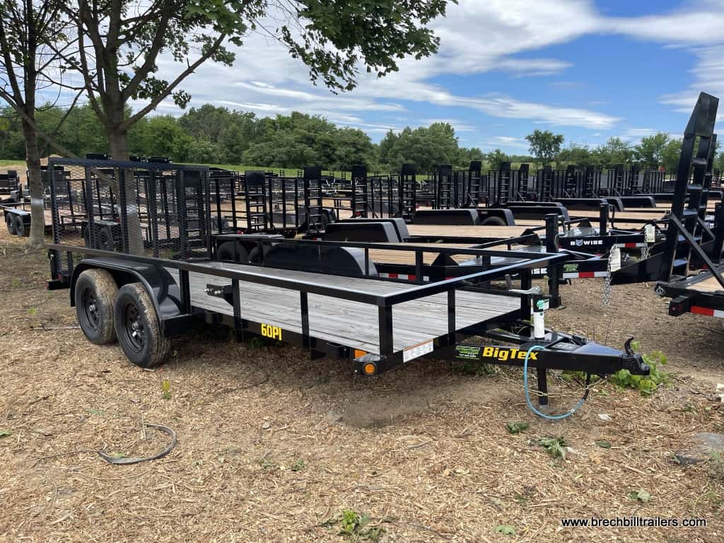 Big Tex 60PI tandem axle pipe top utility trailer parked in the lot.