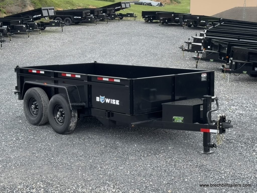 A Bwise LPHD 7x12 Heavy Duty Low Pro Dump Trailer for sale in the lot.