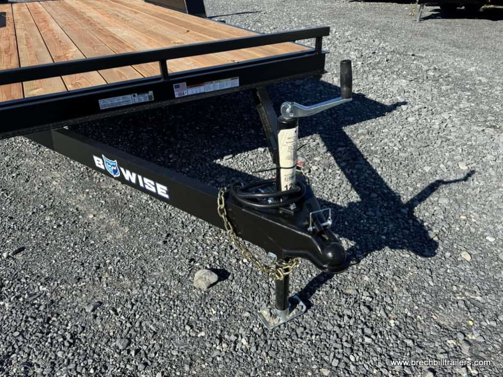 Jack holding up the detached trailer.