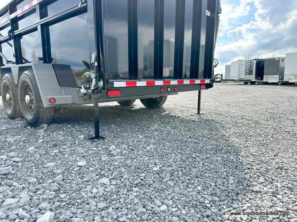 Brand new Bwise DU Ultimate Dump Trailer with stabilizer legs down for demo purposes.