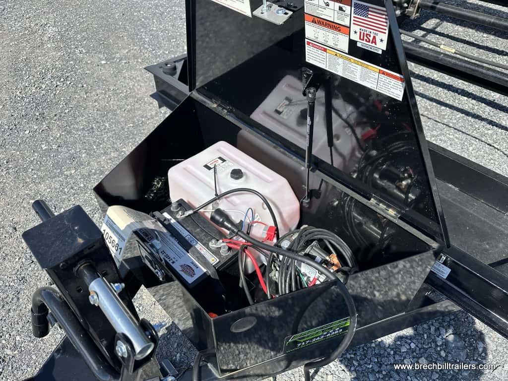 Battery and hydraulic pump on the Bwise LPHD Heavy Duty Low Pro Dump Trailer