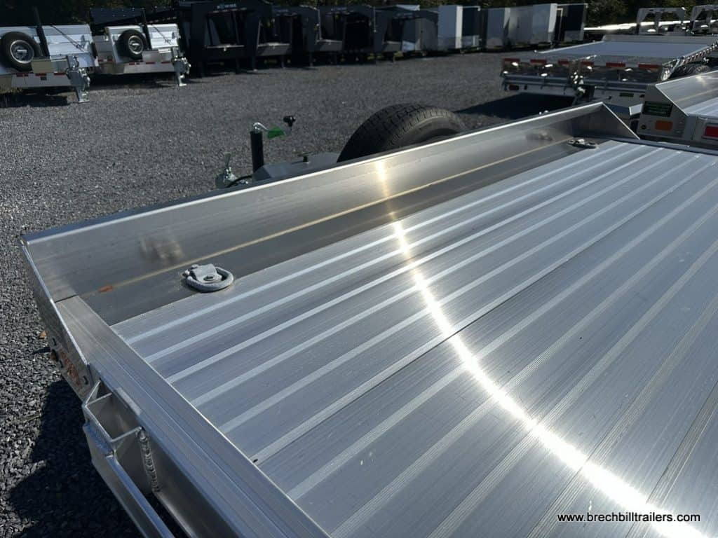 The trailer deck with d rings on it.