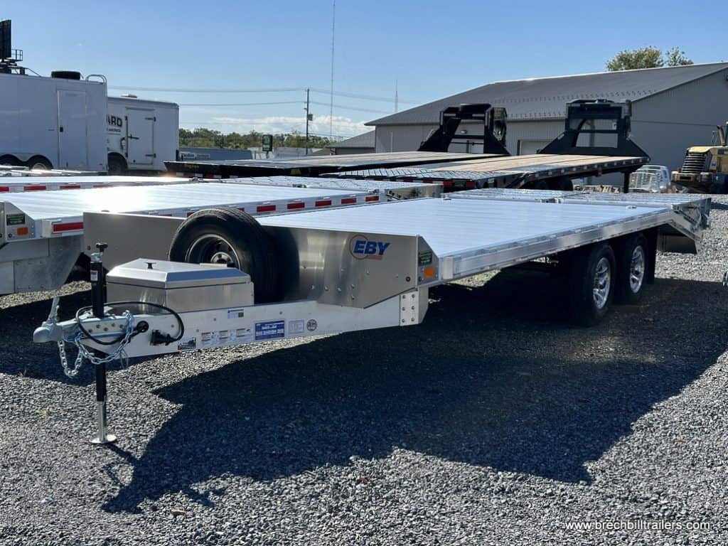 EBY Deck-Over Equipment Trailer parked in the lot.