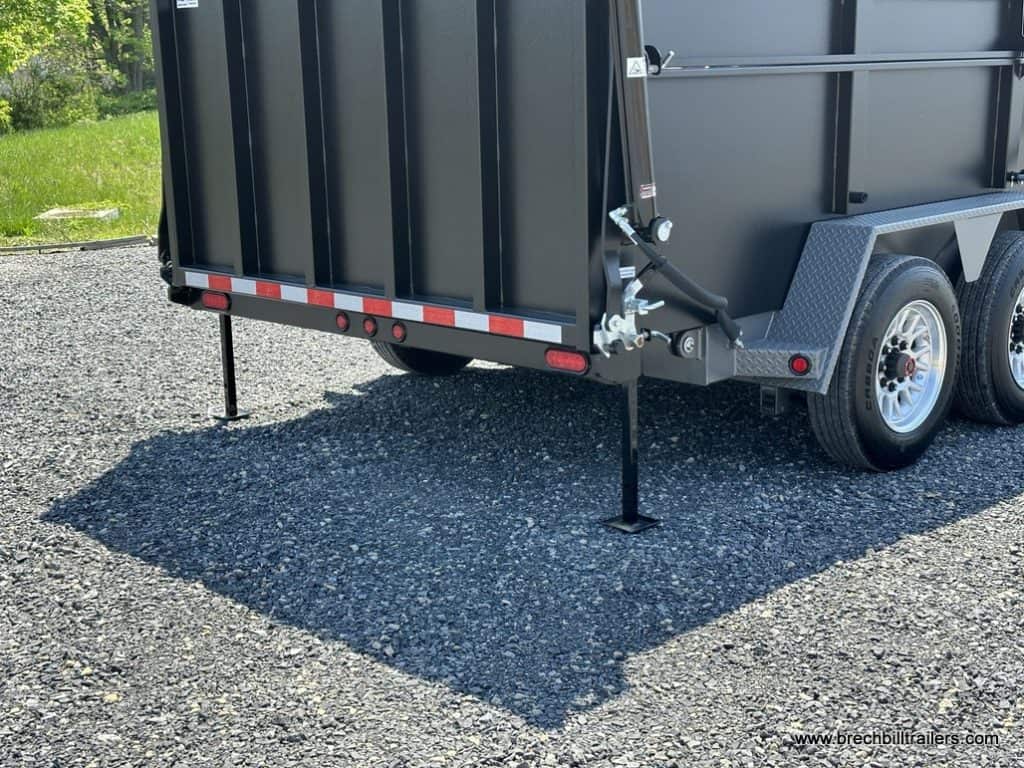A Bwise 19.2K DU Ultimate Dump Trailer with stabilizer legs down