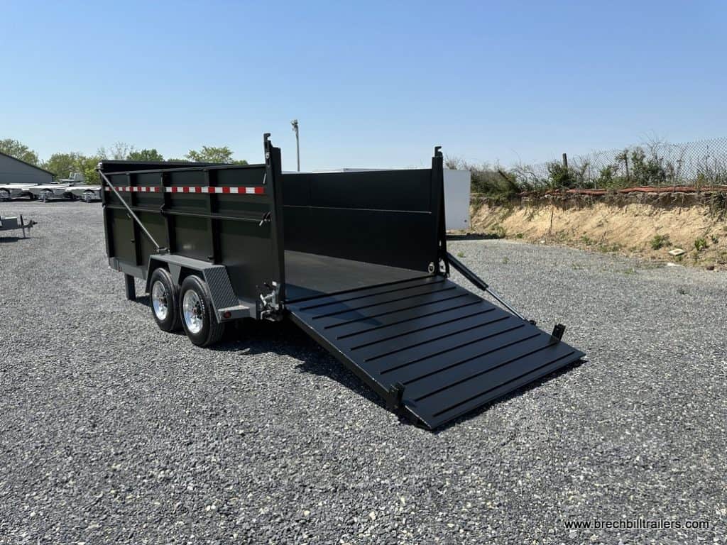 A Bwise 19.2K DU Ultimate Dump Trailer with the ramp down for easy loading.