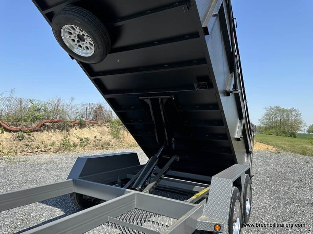 Spare wheel mounted on the bottom of the Bwise dump trailer.
