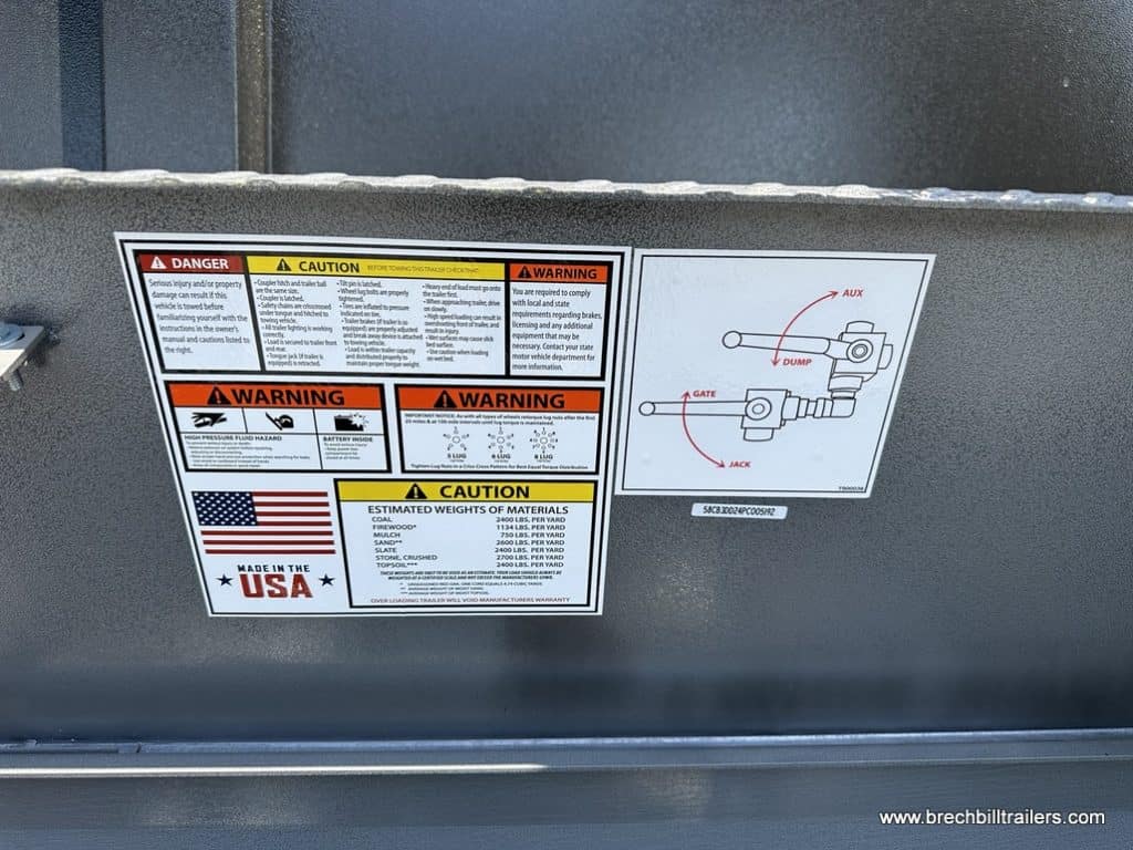 Warning stickers on side of the trailer.