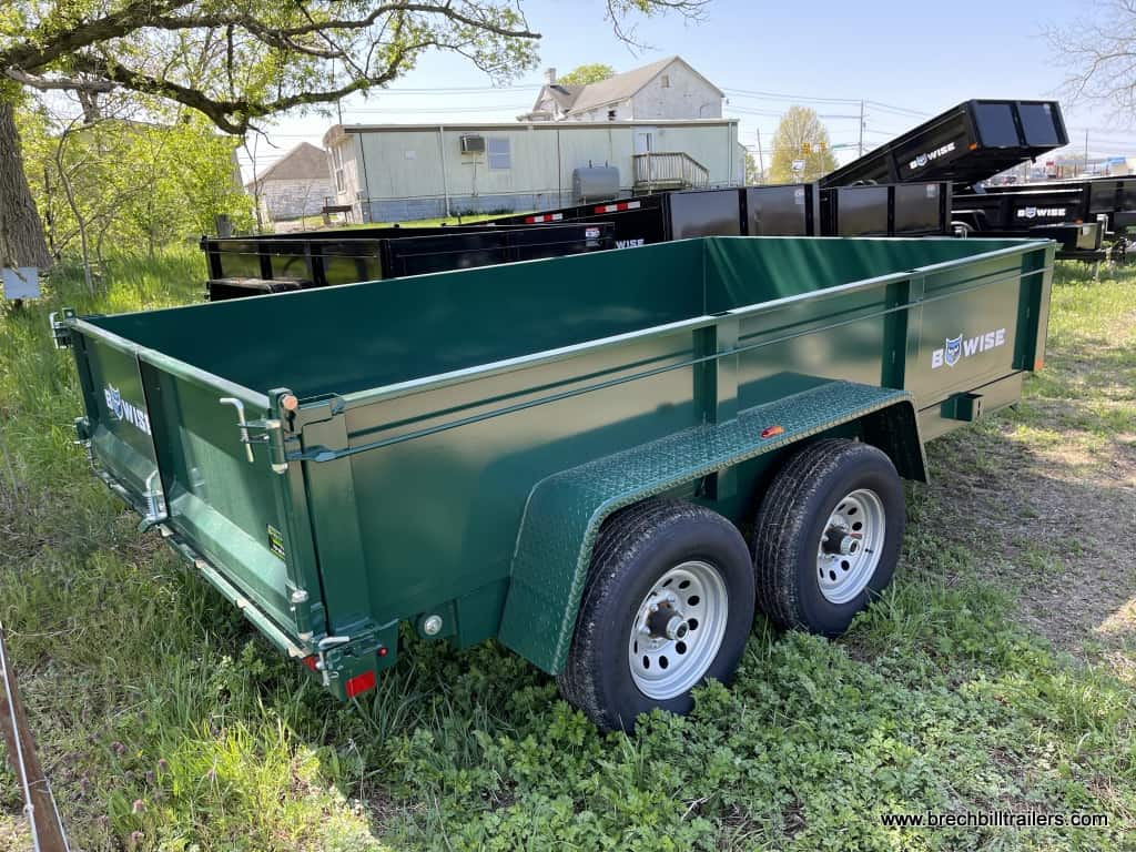 A dark green Bwise dump trailer