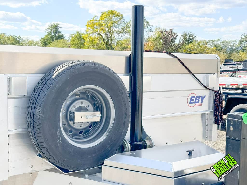 Spare wheel mounted on the 7x16 EBY 14K Aluminum Bumper Pull Dump Trailer
