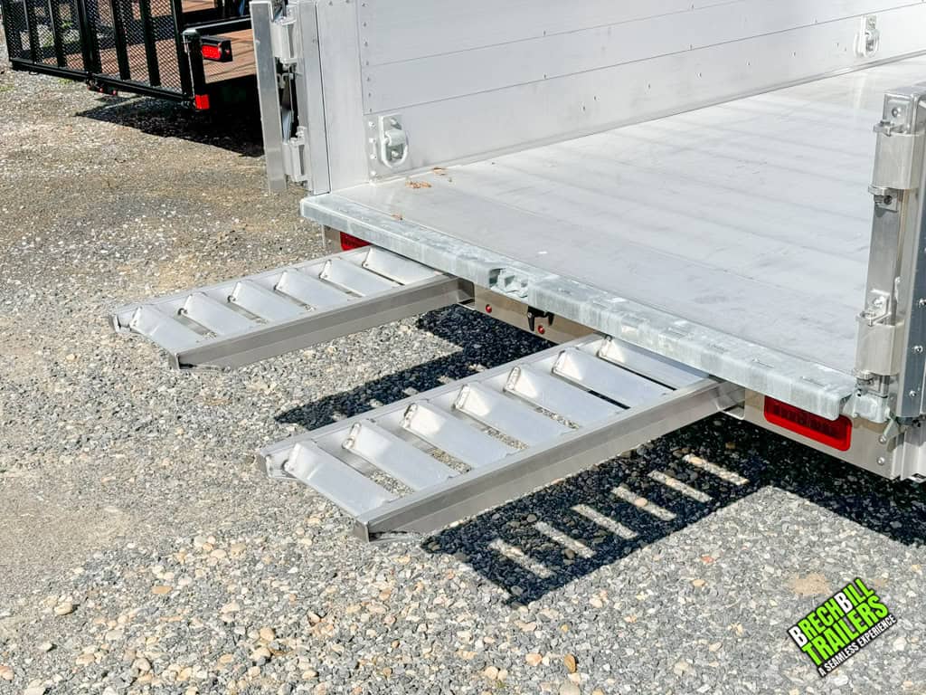 Slide out ramps on the EBY 14K Aluminum Bumper Pull Dump Trailer