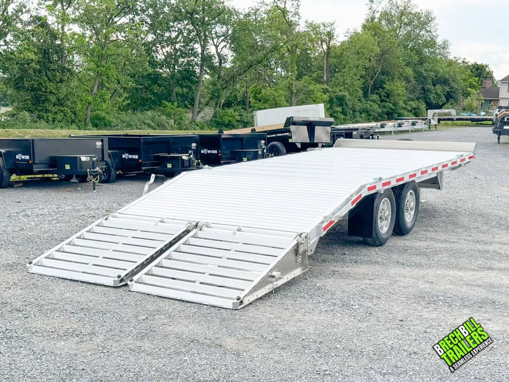 A 20ft EBY Deck-Over 14K Equipment Trailer with the ramps down.