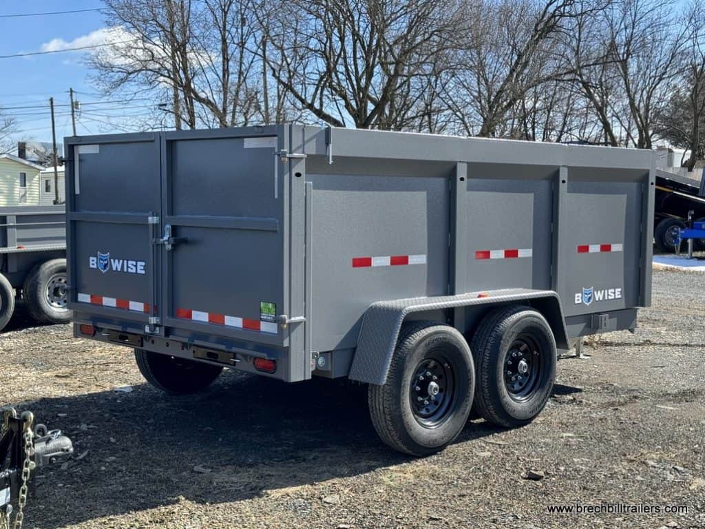 A gray Bwise high side dump trailer.