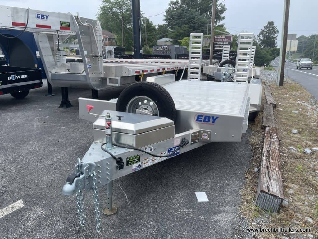 Spare tire mounted on the front of the trailer.