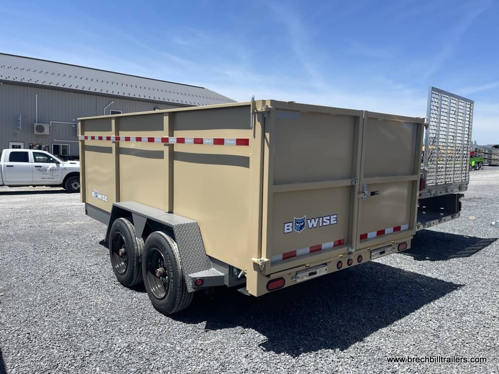 A desert tan Bwise dump trailer for sale in the yard.