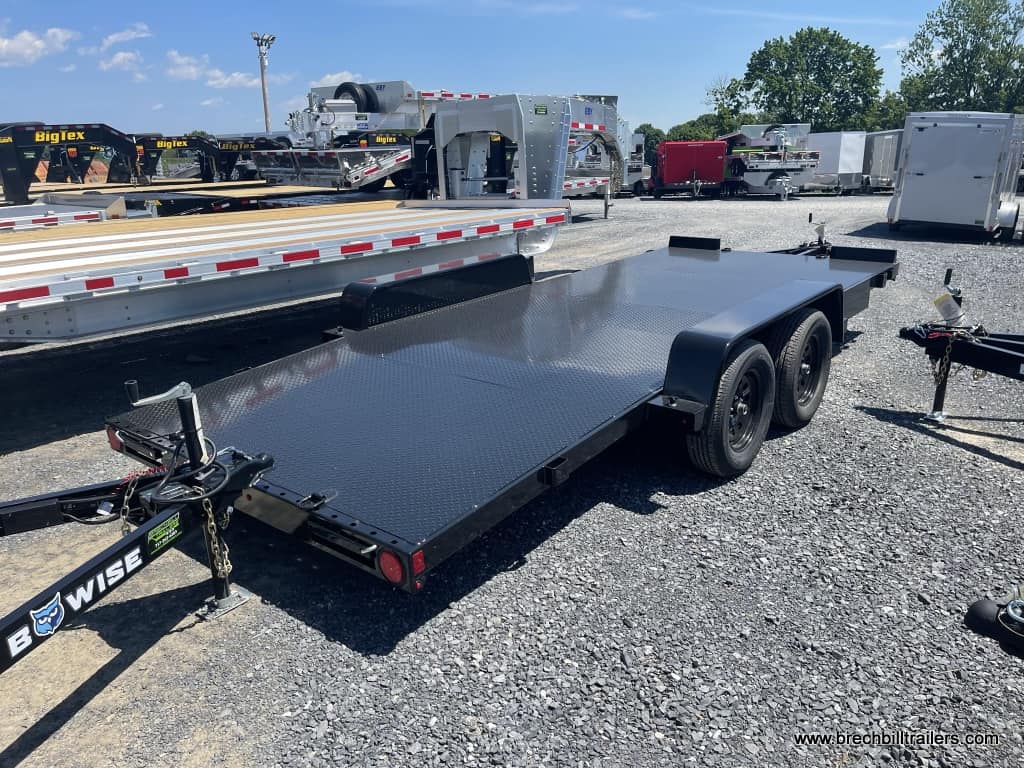 A black Bwise car hauler in the parking lot for sale
