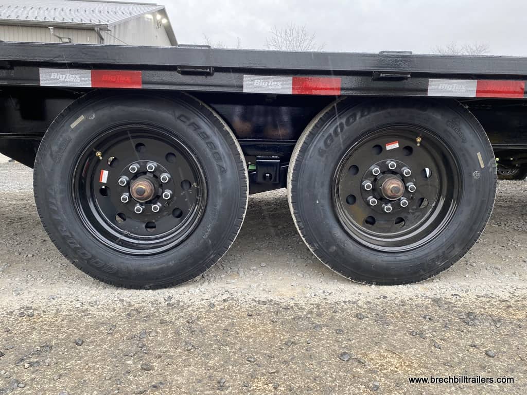 Black wheels on a trailer with mega ramps