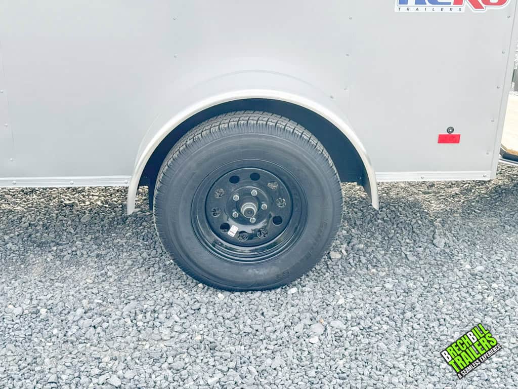 Black wheels on a new 5x8 Bravo Hero Enclosed Cargo Trailer.