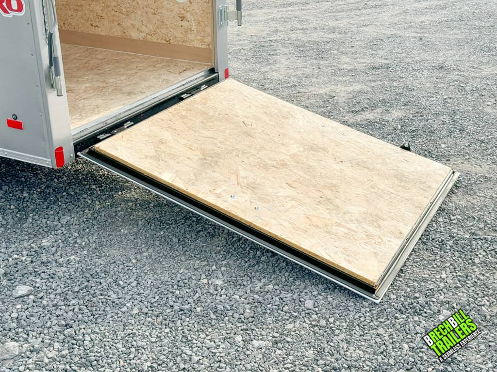 The ramp down on a new Bravo Hero Enclosed Cargo Trailer for demonstration purposes.