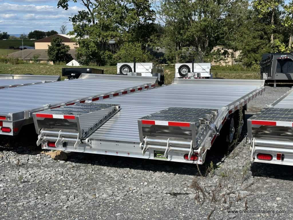 EBY 14K Deck-Over Equipment Trailer with aluminum ramps on the back.