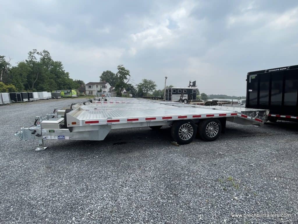 A lot full of EBY Deck-Over 16K Equipment Trailers for sale.