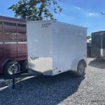A parked Bravo Scout Enclosed Cargo Trailer 5’x8’x3K (SC58SA)