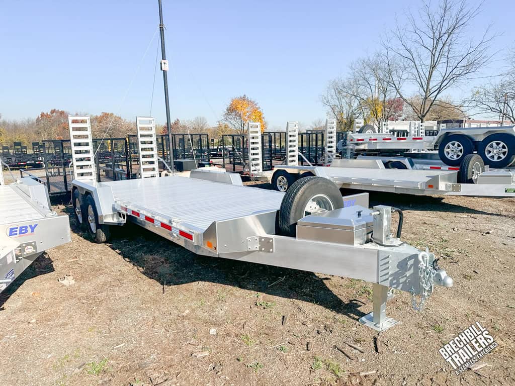A new EBY 14K Low Pro Equipment Trailer parked in the lot.