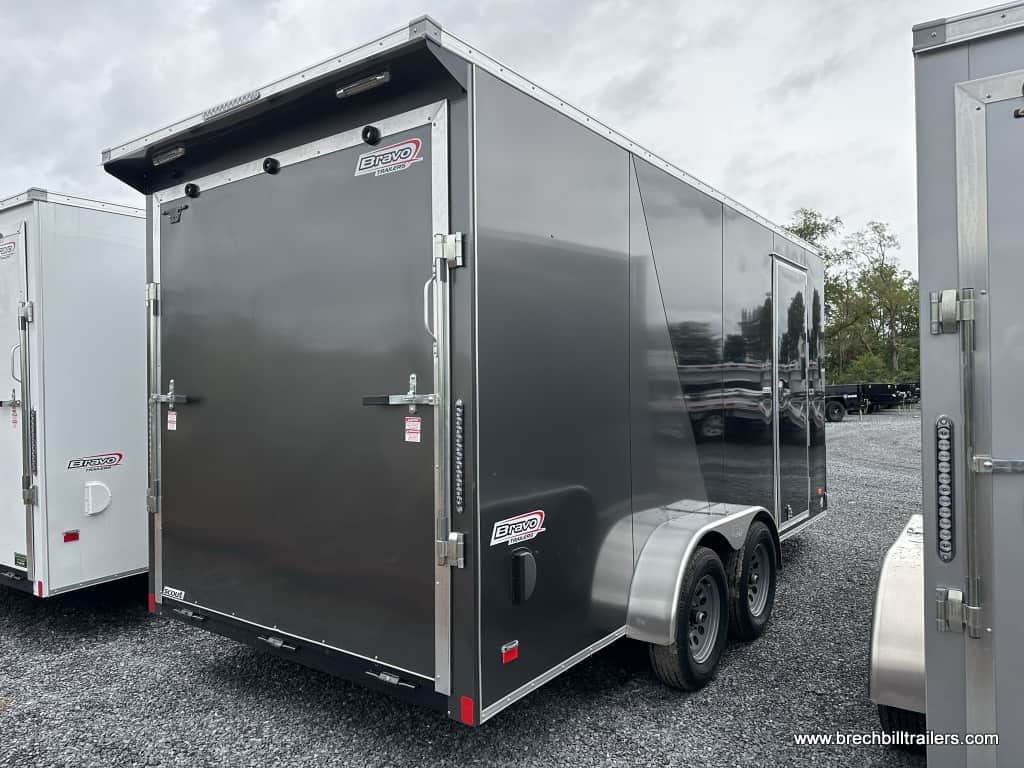 A brand new silver Bravo Scout Enclosed Cargo Trailer