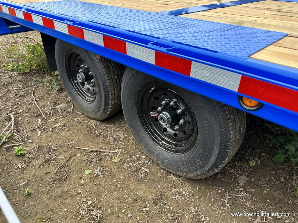 Black wheels on the blue Bwise hydraulic tilt deck trailer