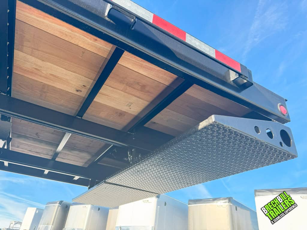 Bottom view of the hydraulic ramps on a Bwise THD22-15 tilt-deck trailer.