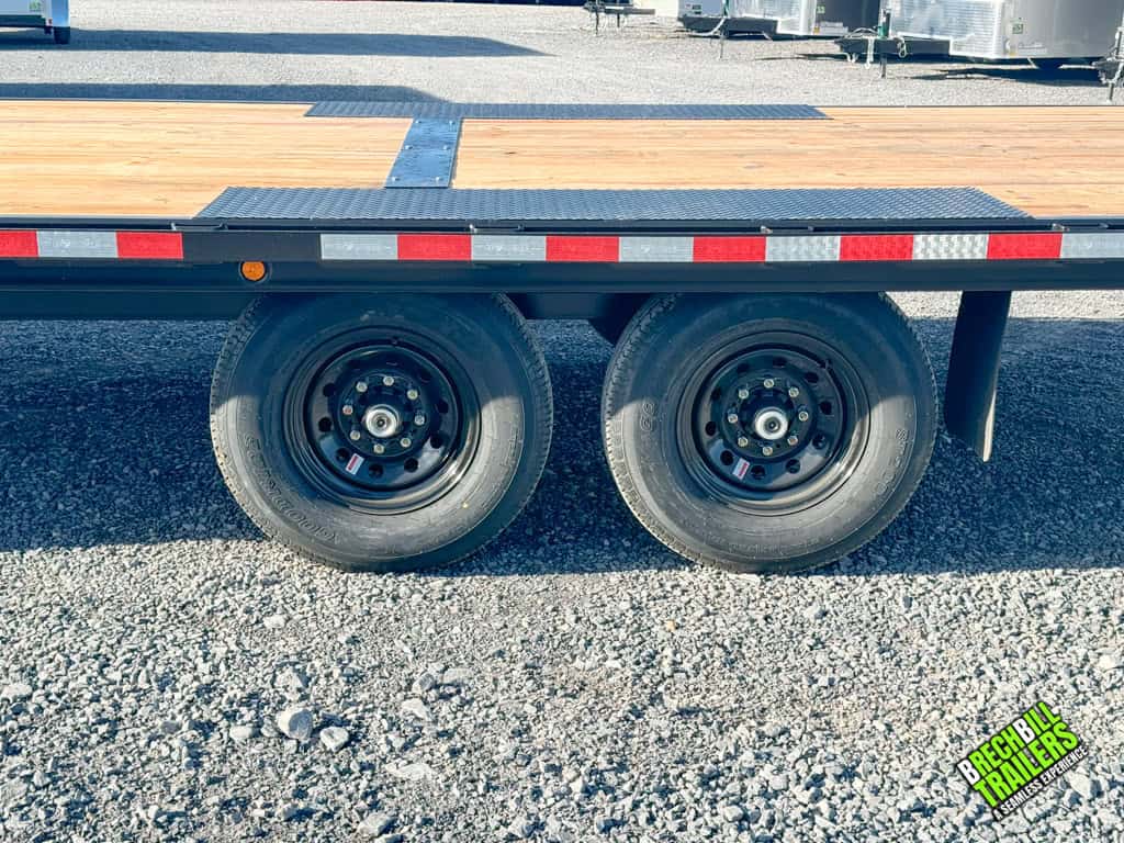 Dual axles on the back of the Bwise THD22-15 tilt-deck trailer.