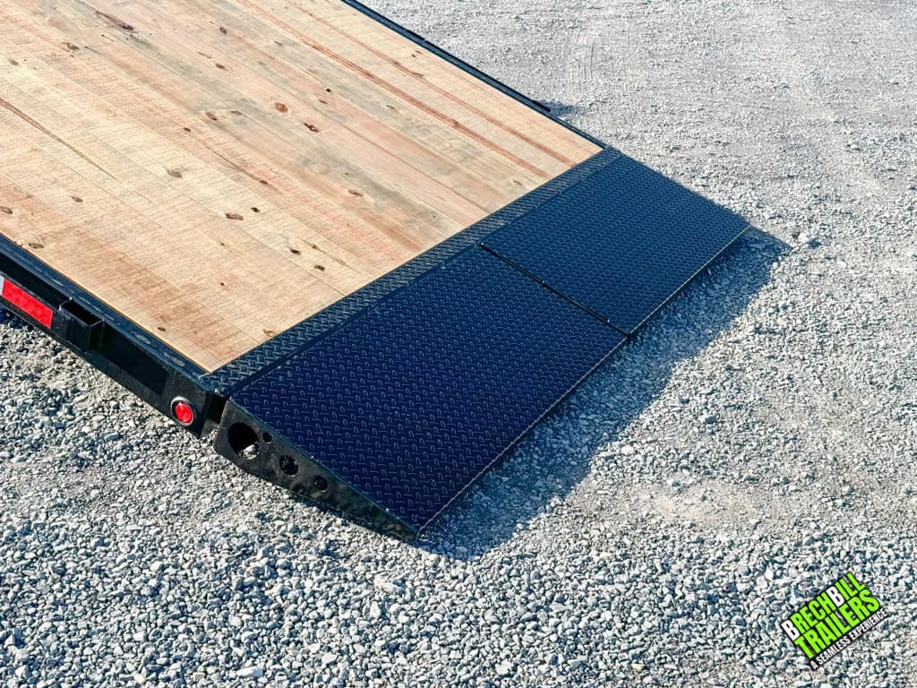 Bwise THD22-15 tild deck trailer lowered for easy loading and unloading of equipment.