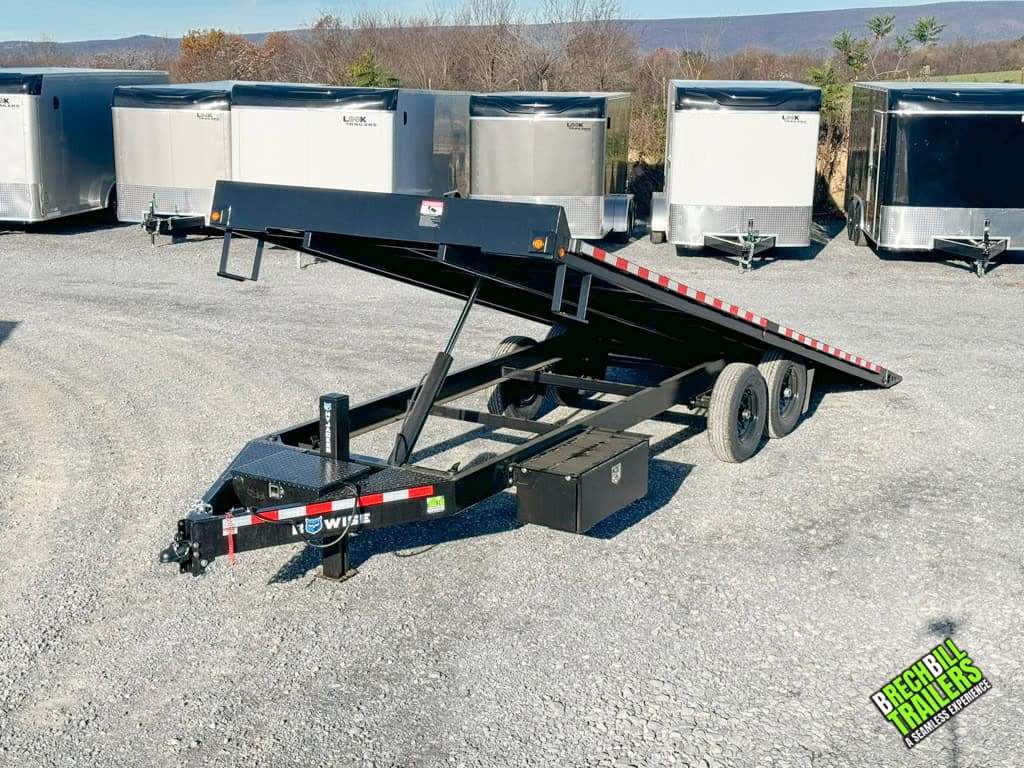 Hydraulic piston raising front of THD22-15 trailer to tilt the rear for easy loading.
