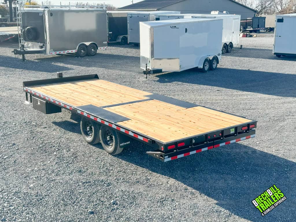 Brand new Bwise Hydraulic 15.4k tilt-deck trailer parked.