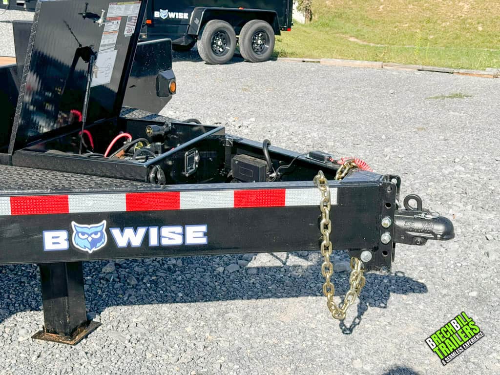 The coupler, power line, chains, and battery box on the Bwise 17.6K Hydraulic Tilt Deck Trailer