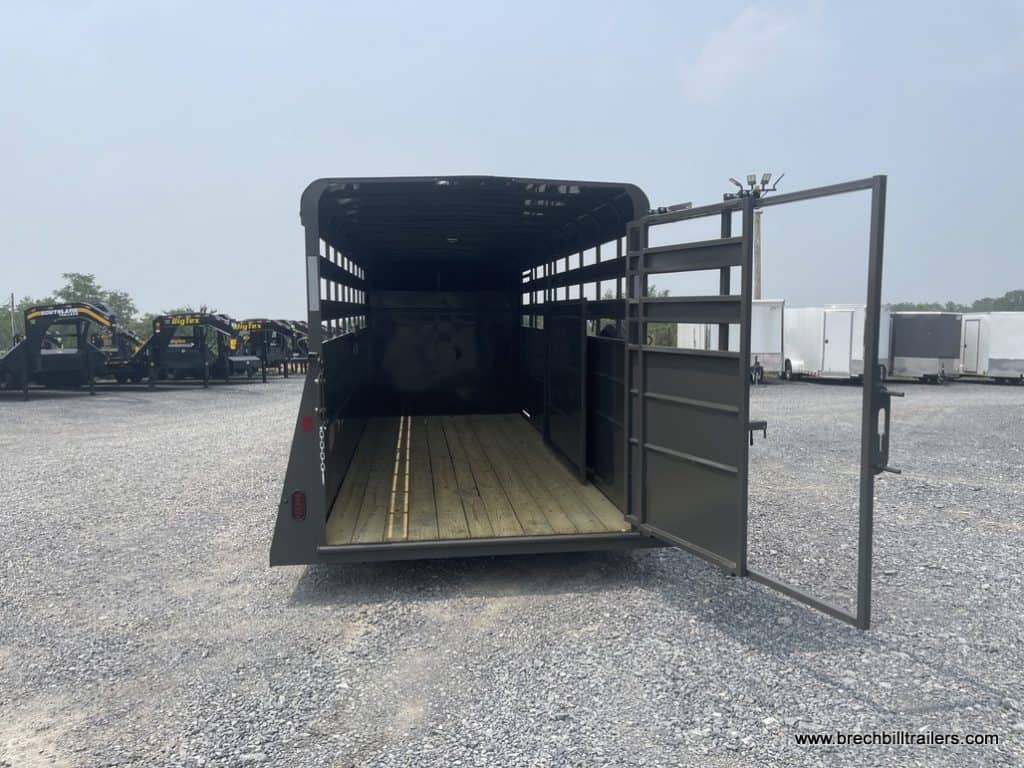 Charcoal Valley 12K Gooseneck Stock Trailer with back door open.