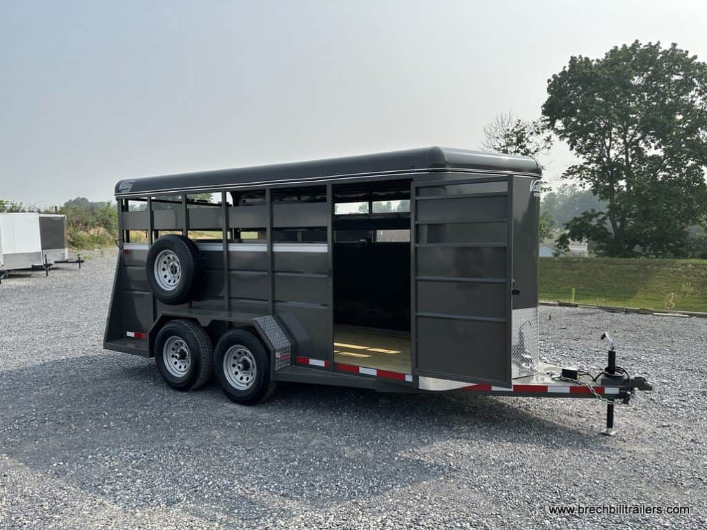 A Valley 12K Stock Trailer parked in the lot.