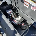 Looking inside the battery box where the hydraulic pump is also located