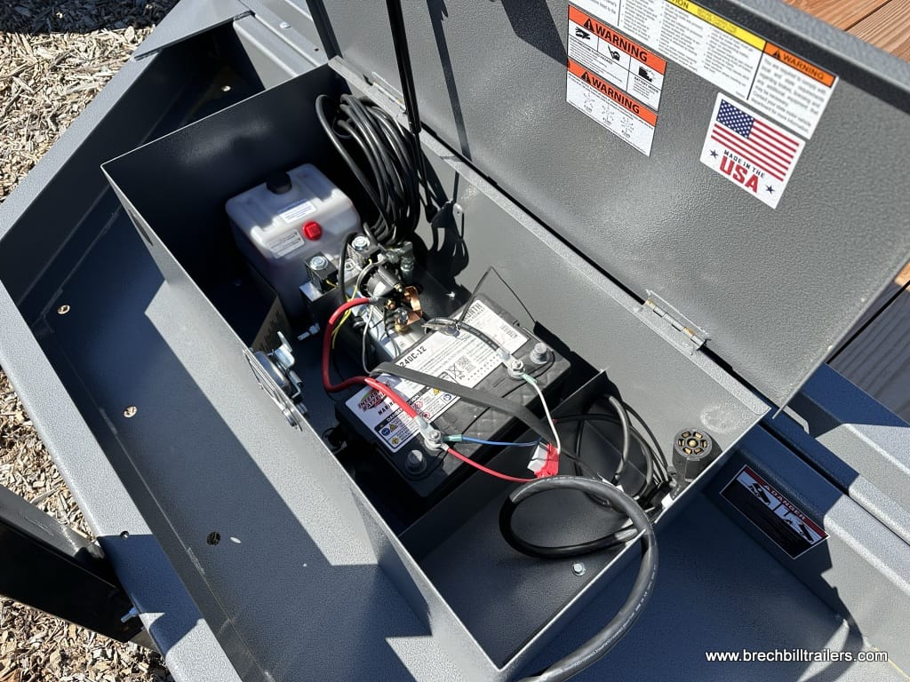 Looking inside the battery box where the hydraulic pump is also located