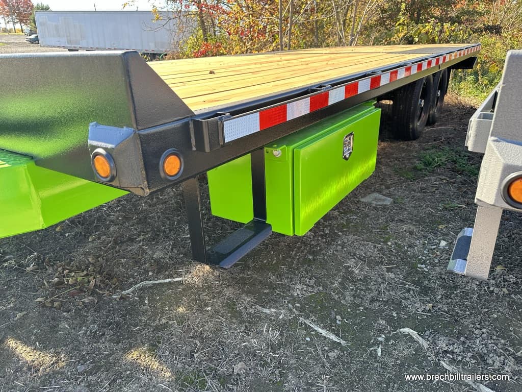 Bwise Hydraulic Tilt-Deck Trailer with green frame and toolbox on the side