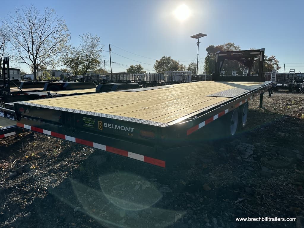 A Belmont Deckover Gooseneck Tilt Deck Equipment Trailer for sale in the parking lot