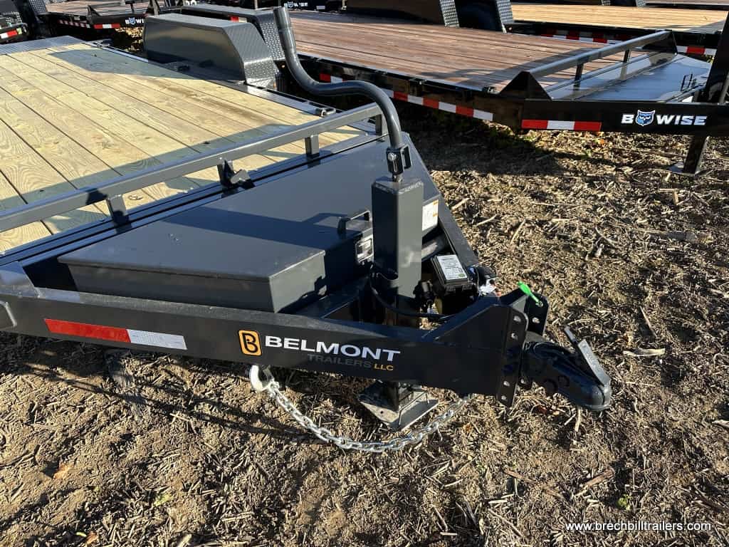 The parked Belmont Low Pro Gravity Tilt Skid Steer Equipment Trailer for sale