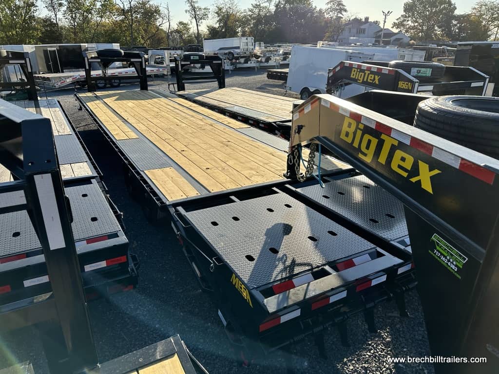 A lot full of Big Tex Single Wheel Tandem Axle Gooseneck Trailers