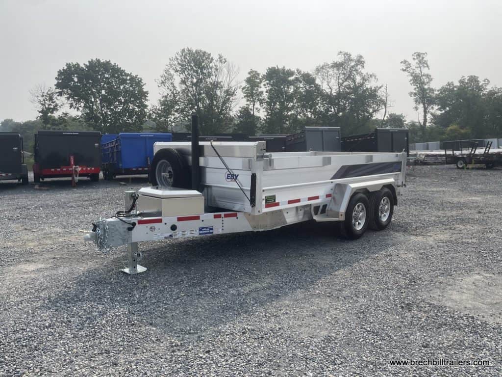 A parked EBY All Aluminum Bumper Pull Dump Trailer for sale in the lot.