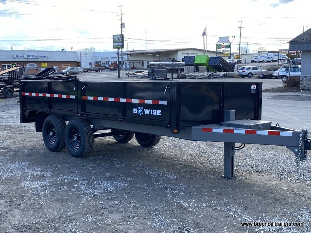 Brand new Bwise Deck Over 15.4K Tube Frame Dump Trailer parked in the lot.
