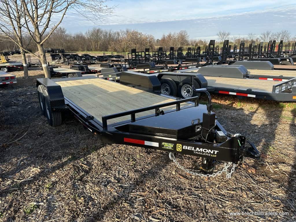 Full view of the Belmont Low Pro Gravity Tilt Skid Steer Equipment Trailer parked in the yard